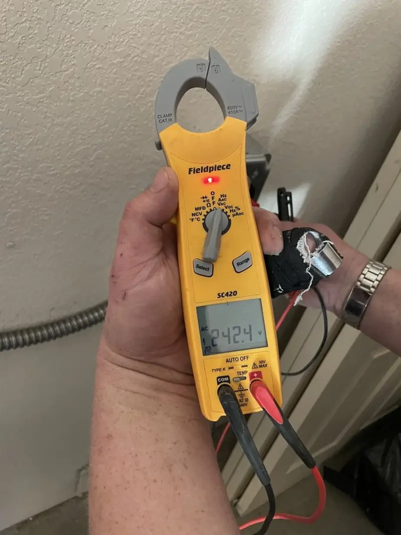 Voltage testing with clamp meter during Generator Installation in Hunters Creek